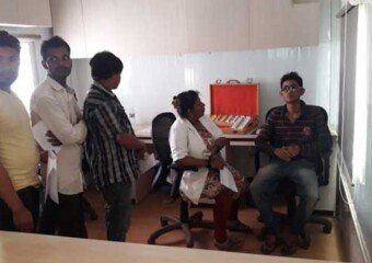 Vision test being carried on contractor workmen