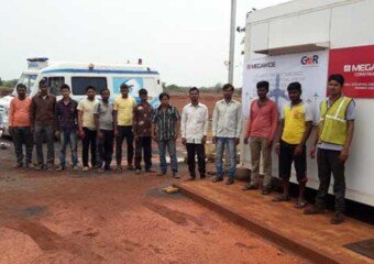 Photograph of contractor workmen waiting in a que for eye check up